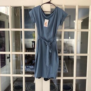 Brand New With tags. Wrap/t-shirt dress size small light blue